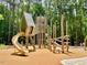 Community playground with slides, climbing structures, and engineered mulch at 104 Odessa Cir, Cary, NC 27513