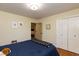 Relaxing bedroom featuring closet and soft natural light at 106 N Lakeside Dr, Smithfield, NC 27577