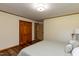 Bright bedroom with a large closet and wood-look flooring at 106 N Lakeside Dr, Smithfield, NC 27577