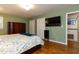 Spacious bedroom with hardwood floors and a wall-mounted television at 106 N Lakeside Dr, Smithfield, NC 27577