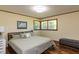 Comfortable bedroom featuring large windows and neutral decor at 106 N Lakeside Dr, Smithfield, NC 27577