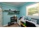 Craft room with shelving and storage, a sewing machine, and a view of the outside at 106 N Lakeside Dr, Smithfield, NC 27577