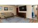 Comfortable living room with a TV, sofa, accent rug, and access to the ensuite bathroom at 106 N Lakeside Dr, Smithfield, NC 27577
