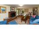 Relaxing living room featuring a brick fireplace and comfortable seating at 106 N Lakeside Dr, Smithfield, NC 27577