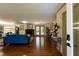 Spacious living room features a brick fireplace, wood floors, and glass doors to the backyard at 106 N Lakeside Dr, Smithfield, NC 27577