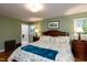 Main bedroom featuring a bed, hardwood floors, and an ensuite bathroom at 106 N Lakeside Dr, Smithfield, NC 27577
