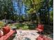 Cozy backyard patio area with outdoor furniture and a view of the lake and storage shed at 106 N Lakeside Dr, Smithfield, NC 27577