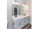 Bathroom features a double sink vanity with marble countertop and modern fixtures at 1071 Turlington Rd, Dunn, NC 28334