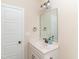 Bright half bathroom features a modern vanity with marble countertop and bronze fixtures at 1071 Turlington Rd, Dunn, NC 28334