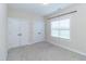 Clean bedroom features neutral carpet, one window, and two spacious closets at 1071 Turlington Rd, Dunn, NC 28334