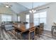 Bright dining area adjacent to the living room, with a modern ceiling fan at 1071 Turlington Rd, Dunn, NC 28334