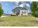 Attractive home featuring a well-maintained lawn, complemented by mature trees at 1071 Turlington Rd, Dunn, NC 28334