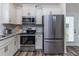 Bright kitchen features stainless steel appliances, granite countertops, and a stylish subway tile backsplash at 1071 Turlington Rd, Dunn, NC 28334