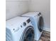 Modern laundry room features new washer and dryer with sleek designs and efficient performance at 1071 Turlington Rd, Dunn, NC 28334