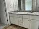 Modern bathroom featuring a double sink vanity with granite countertop and white cabinetry at 110 Coharie Dr, Lillington, NC 27546