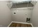 Laundry room featuring wood look flooring and washer and dryer hookups at 110 Coharie Dr, Lillington, NC 27546