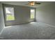 Bright bedroom with neutral walls, carpet, and large windows that offer plenty of natural light at 110 Coharie Dr, Lillington, NC 27546