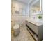 Stylish bathroom features a modern vanity with open shelving and a lighted mirror at 112 Noble St, Chapel Hill, NC 27516