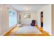 Inviting bedroom with hardwood floors, stylish seating, and natural light at 112 Noble St, Chapel Hill, NC 27516