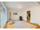 Bright bedroom with hardwood floors, stylish seating, and access to kitchen at 112 Noble St, Chapel Hill, NC 27516