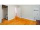 Bedroom featuring hardwood floors with adjoining bathroom at 112 Noble St, Chapel Hill, NC 27516
