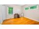 Bedroom features hardwood floors, natural light, and a closet for storage at 112 Noble St, Chapel Hill, NC 27516
