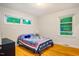 Bright bedroom with hardwood floors, natural light, and a comfy bed at 112 Noble St, Chapel Hill, NC 27516