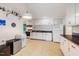 Functional kitchen features white cabinets, updated appliances, and great natural light at 112 Noble St, Chapel Hill, NC 27516