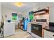 Functional kitchen with essential appliances and blue and white movable kitchen island at 112 Noble St, Chapel Hill, NC 27516