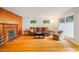 Inviting living room with a fireplace, wood paneling and hardwood floors at 112 Noble St, Chapel Hill, NC 27516