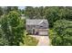 An aerial view highlights this home's attractive facade, manicured lawn, and mature trees at 113 Paladin Place, Cary, NC 27513