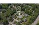 An aerial shot showcases a home nestled among mature trees within a quiet, established neighborhood at 113 Paladin Place, Cary, NC 27513