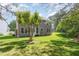 Expansive backyard featuring a lush lawn, mature trees, and ample space for outdoor activities and relaxation at 113 Paladin Place, Cary, NC 27513