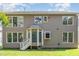 Backyard featuring an exterior elevation and well-maintained lawn at 113 Paladin Place, Cary, NC 27513