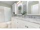 Bathroom featuring double sinks, white marble countertop, and shower/tub combination at 113 Paladin Place, Cary, NC 27513