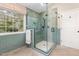 Modern walk-in shower with subway tile surround and window for natural light at 113 Paladin Place, Cary, NC 27513