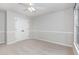 Bedroom with plush carpet, double closet, and neutral walls at 113 Paladin Place, Cary, NC 27513