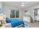 Cozy bedroom with ensuite bath, bright window, and blue accent decor at 113 Paladin Place, Cary, NC 27513