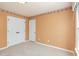 Bedroom with plush carpet, double closet, and neutral walls at 113 Paladin Place, Cary, NC 27513