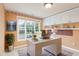 Bright home office with a large window, stylish desk, and custom shelving at 113 Paladin Place, Cary, NC 27513