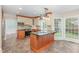 Spacious kitchen with a center island, custom cabinetry, stainless appliances, and lots of natural light at 113 Paladin Place, Cary, NC 27513
