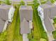 An aerial view captures the architectural layout and green spaces between neighboring homes at 1144 Survada Ln, Morrisville, NC 27560