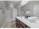 Bathroom with neutral tile floor, a single vanity, and tub-shower combo with curtain at 1144 Survada Ln, Morrisville, NC 27560