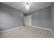Bedroom with carpet, neutral walls, and a modern chandelier fixture at 1144 Survada Ln, Morrisville, NC 27560