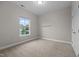 Bedroom with carpet, neutral walls, natural light, and a built in shelf at 1144 Survada Ln, Morrisville, NC 27560