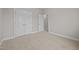 Bedroom with carpet, neutral walls, closet, and attached ensuite bath at 1144 Survada Ln, Morrisville, NC 27560