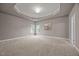 Spacious bedroom with carpeted floors, tray ceiling, and recessed lighting at 1144 Survada Ln, Morrisville, NC 27560