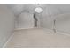 Expansive bonus room features carpet and a vaulted ceiling with three large windows at 1144 Survada Ln, Morrisville, NC 27560