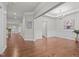 Spacious dining room featuring hardwood floors, elegant chandelier, and wainscoting details at 1144 Survada Ln, Morrisville, NC 27560