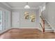 Formal dining area boasts hardwood floors, crown molding, and elegant French doors to the exterior at 1144 Survada Ln, Morrisville, NC 27560